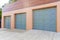 Three side-hinged garage doors with gold door handles at San Francisco, California