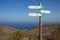 Three signposts for hikers showing the way at north coast of La Gomera Canary Islands