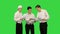 Three similar dressed guys reading and discussing some documents on a Green Screen, Chroma Key.