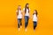 Three sister ladies holding arms spending weekend walking shopping wear casual outfit isolated yellow background