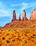 The Three Sisters, a massive Red Sandstone Pinnacle Formation in Monument Valley