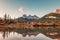 Three sisters mountains of rocky mountains reflection on bow river in the morning at Canmore, Banff national park