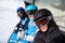 Three skiers ride on funicular in mountains