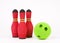 Three skittles bowling and green ball isolated on a white background