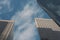 Three Sky Scrapers with Blue Sky and Clouds