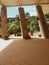 Three slanted rock columns with brown bricked floor and green foliage on the background at Caleruega, Batangas, Philippines