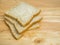 Three slice whole wheat bread on wooden table