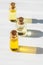 Three small bottle of glass essential oil with a cork stopper for aromatherapy and massage