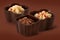 Three small chocolate basket with cream