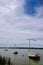 Three small docked boats in a quiet marina