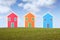 Three small isolated houses on a hill