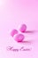Three small pink eggs on pink background. Easter celebrate concept. Copy space
