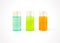 Three small plastic bottles full of colorful cosmetic products