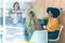 Three smart entrepreneur women talking while taking a break and having a breakfast in the kitchen at coworking place