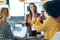 Three smart entrepreneur women talking while taking a break and having a breakfast while taking a photo in the kitchen at