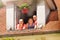 Three smiling girls in the open attic window