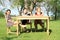 Three smiling girls sitting around the table