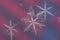 Three snow flakes on red and blue background