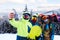 Three snowboarders taking selfie with smartphone camera at ski resort. Friends photographing for social network sharing