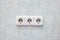 Three sockets on a green wall closeup