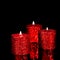 Three spangled candles in the dark