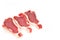 Three Spanish beef steaks on paper isolated