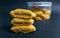 three stack of nastar cookies in front of jar with black background