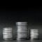Three stacks of coins on a black background
