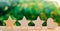 Three stars and heart on a green bokeh background. four star rating, the choice of the editorial office and the buyer. concept of