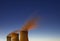 Three Steaming Cooling Towers At Night