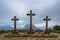 Three stone crosses on top of a hill