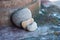 Three stone pebbles in shaped heart on stoned wall in outdoor - Love concept