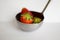 Three strawberries in ladle (dipper)