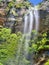 Three-stream waterfall in awesome mountains