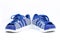 Three strips side decoration on net color blue shoes in kid size footware on isolated white background