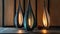 three stylish anthracite grey metal pendulum lamps, emitting a warm, bright light and accented with sleek metal rims