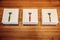 Three stylish razors with boxes on the wooden table