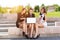 Three Successful businesswomen in the city on a bench discussed