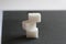 three sugar cubes are stacked on top of each other or in a pyramid on a white gray and black background with space for inserting t