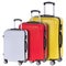 Three suitcases red, white and yellow