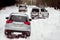 Three SUVs in the woods in winter in the rally