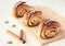 Three sweet rolls with cinnamon and cardamom