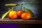 Three Tachibana Citruses on Wooden Shelf