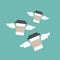 Three take-out flying coffee cups with wings. disposable cardboard cup of coffee
