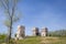 Three tall old abandoned historical limestone kilns.