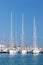 Three tall sailing ships moored in sunny Spanish port or harbour