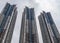 Three tall tower of apartments along harbor of Hong Kong, China