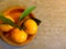 Three tangerines plate copy space background