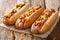 Three tasty chili hot dogs with cheddar cheese, onion and spicy