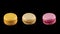 Three tasty colorful macarons rotating